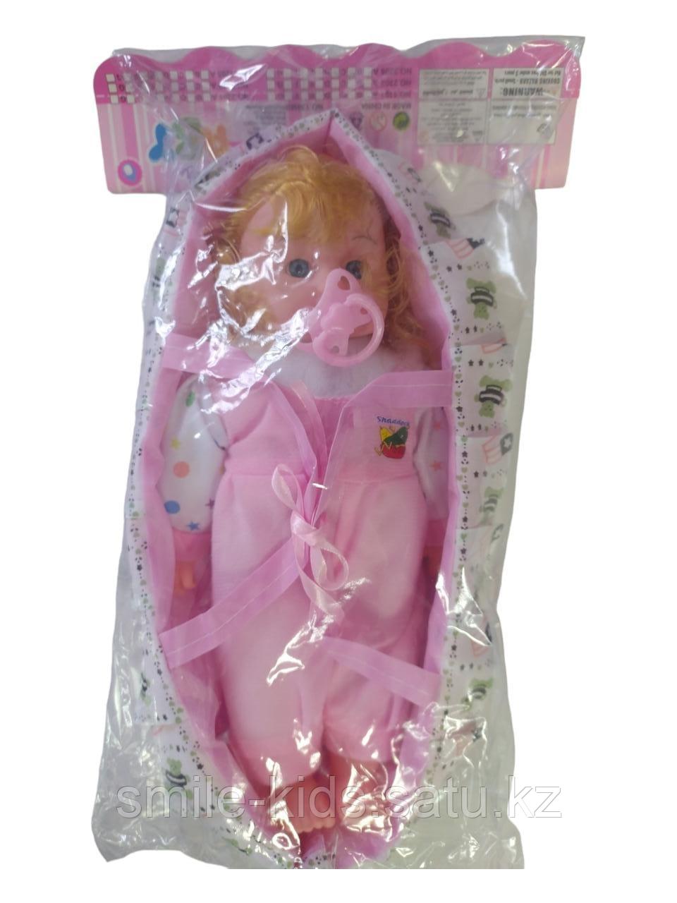 Кукла в люльке