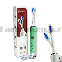 Электрическая зубная щетка зеленого цвета