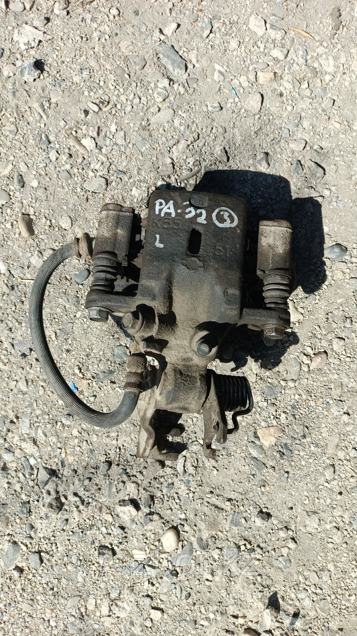 Суппорт левый задний Nissan Maxima