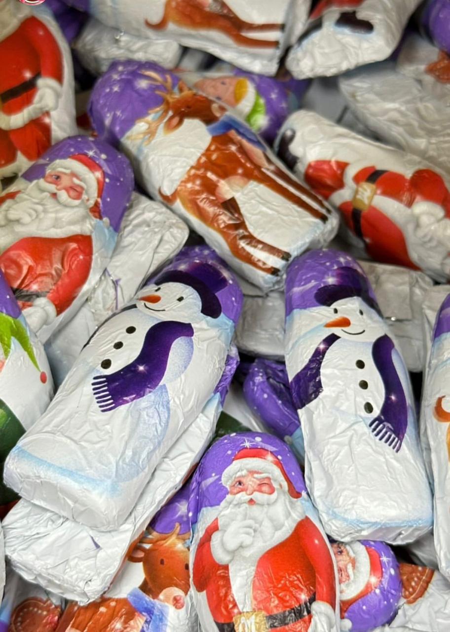 Шоколадные конфеты MILKA Новогодние Фигурки (Дед Мороз , Снеговик и Эльф) 1кг (на вес)