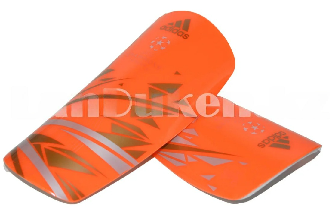Футбольные щитки под гетры без резинок оранжевые с геометрическими узорами
