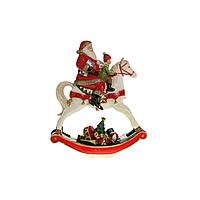 Kaemingk B. V. Декорация Санта в красном с мальчиком на белой лошадке-качалке 29х11х34
