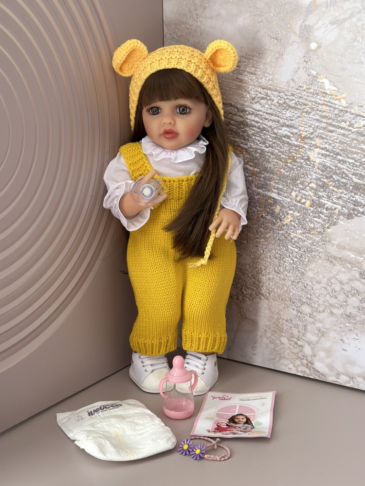 Кукла реборн Baby Born Sisi говорящая в желтом 55 см аксессуары в комплекте, руки и ноги подвижные