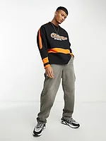 ASOS DESIGN oversized hockey jersey with city print in black and orange
