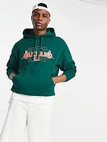 ASOS DESIGN oversized hoodie in dark green with varsity city print
