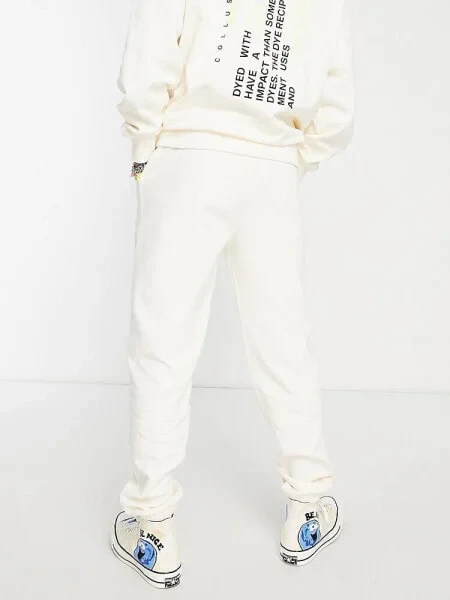 COLLUSION Unisex joggers with text print in ecru co -ord - IVORY - фото 2 - id-p116163010