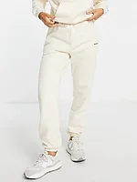 Carhartt WIP relaxed joggers with small logo in cream co-ord