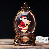 Снежный шар с Санта-Клаусом 10 см светящийся бронза