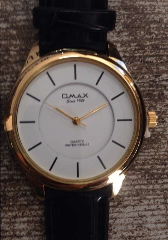 Часы Omax (Япония),  с логотипом.