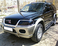 Защита фар Mitsubishi Montero Sport/ Pajero Sport/ Nativa 2000-2007 тёмная